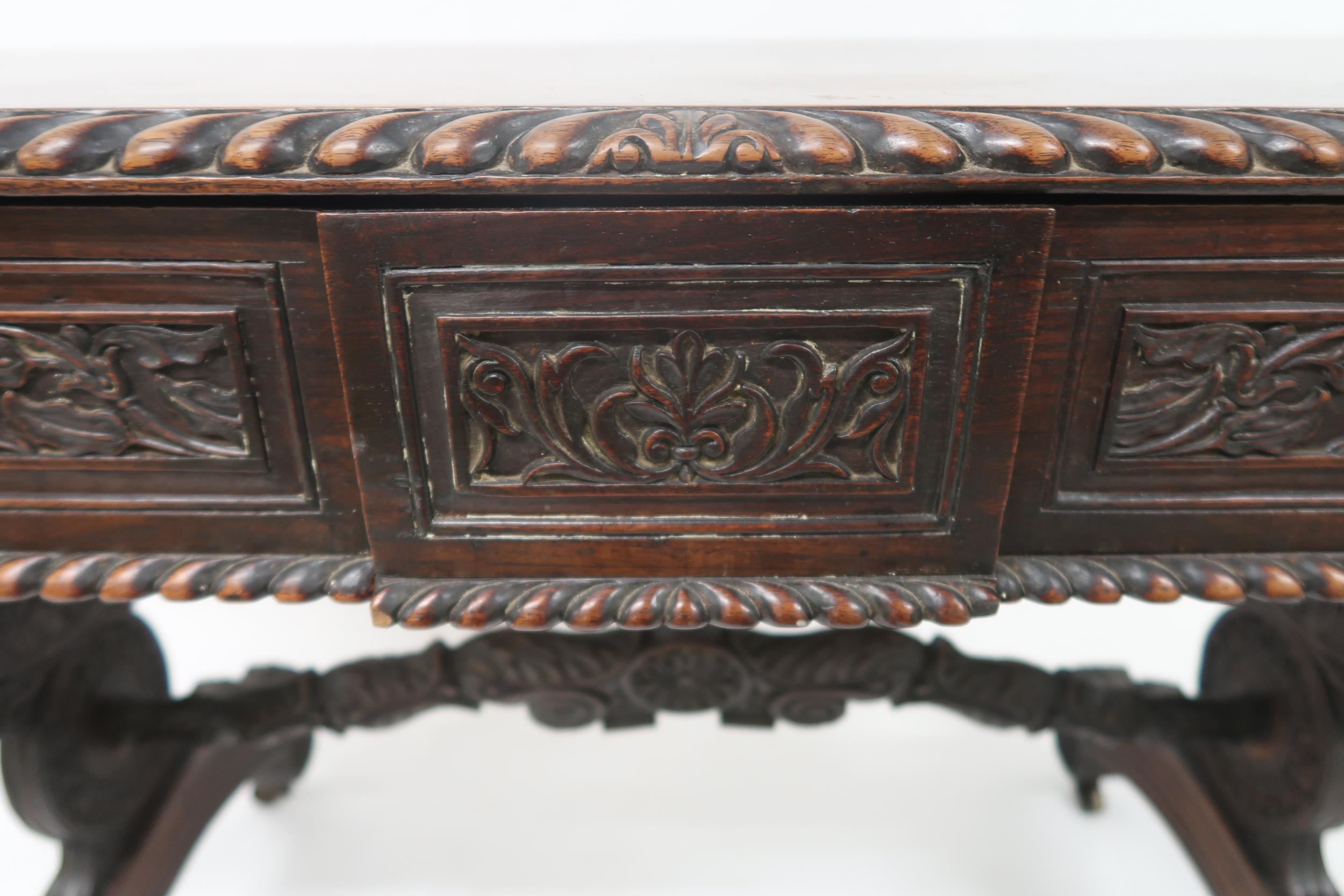 AN ANGLO-INDIAN ROSEWOOD LIBRARY TABLE with rectangular gadrooned top over a pair of asymmetrical - Image 13 of 13