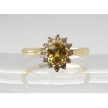 A YELLOW SAPPHIRE AND DIAMOND CLUSTER RING set throughout in 18ct yellow gold, finger size N, weight