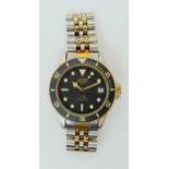 A VINTAGE HEUER WRISTWATCH circa 1983, steel and gold plate diver's watch.  The watch has a black