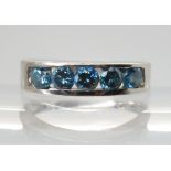 A BLUE DIAMOND RING mounted in 14k white gold, set with estimated approx 0.60cts of brilliant cut