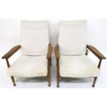 A PAIR OF GEORGE FEJER AND ERIC PAMPHILON FOR GUY ROGERS "MANHATTAN" RECLINING ARMCHAIRS with