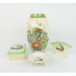 A CARLTON WARE SUMMER FLOWERS VASE 26cm high, together with three Empire Exhibition 1938 pieces