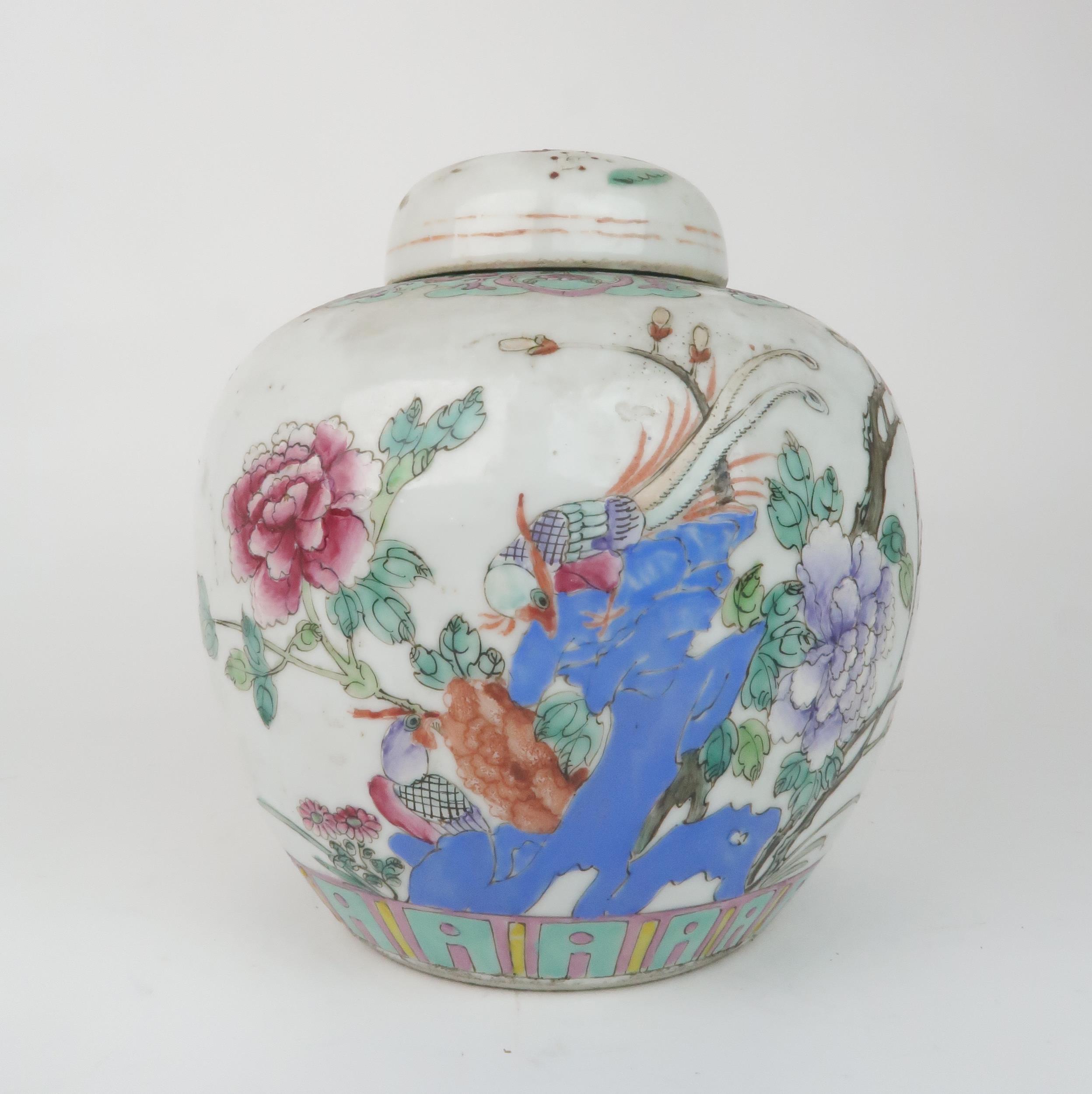 A CHINESE FAMILLE ROSE GINGER JAR AND COVER  painted with birds amongst foliage within formal bands,