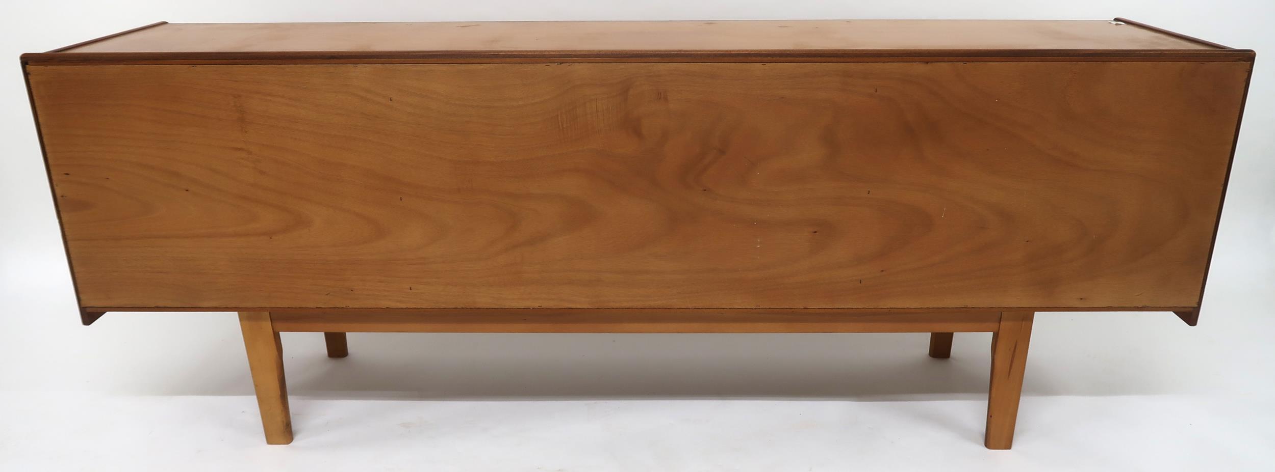 A MID 20TH CENTURY TEAK SIDEBOARD with three long central drawers flanked by cabinet doors with - Image 12 of 12