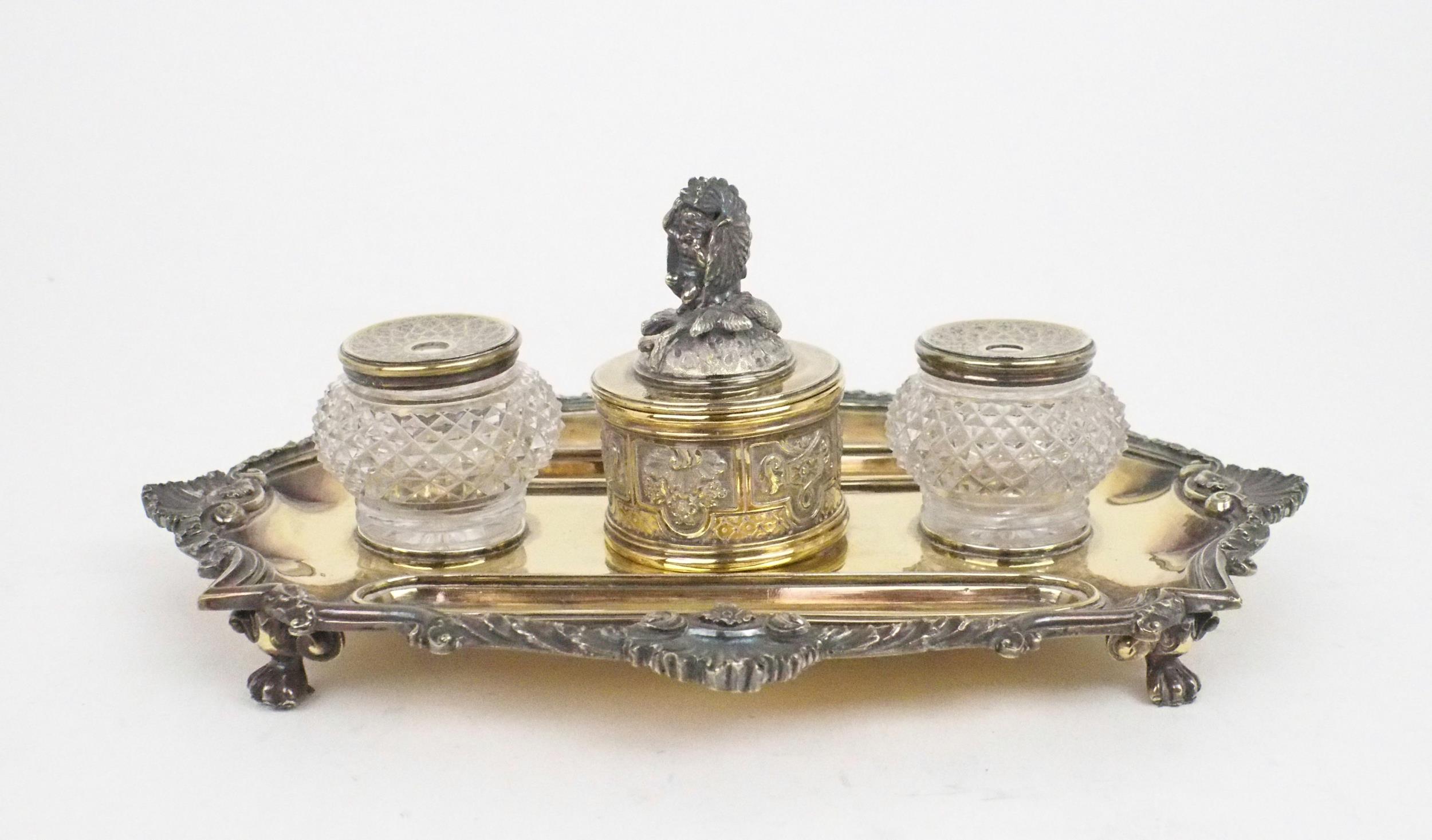 A GEORGE IV SILVER GILT INKSTAND by Richard Sibley, London 1827, of oblong lobed form, with a cast