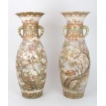 A PAIR OF KAGA TWO HANDLED VASES  painted with birds amongst flowers, fruit and foliage on a trellis