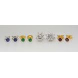 AN 18CT DIAMOND FLOWER EARRING SET with interchangeable centres, of ruby, emerald and sapphire.