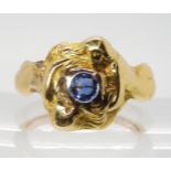 A FRENCH ART NOUVEAU MERMAID RING the two mermaids with flowing hair embrace a sapphire. Stamped