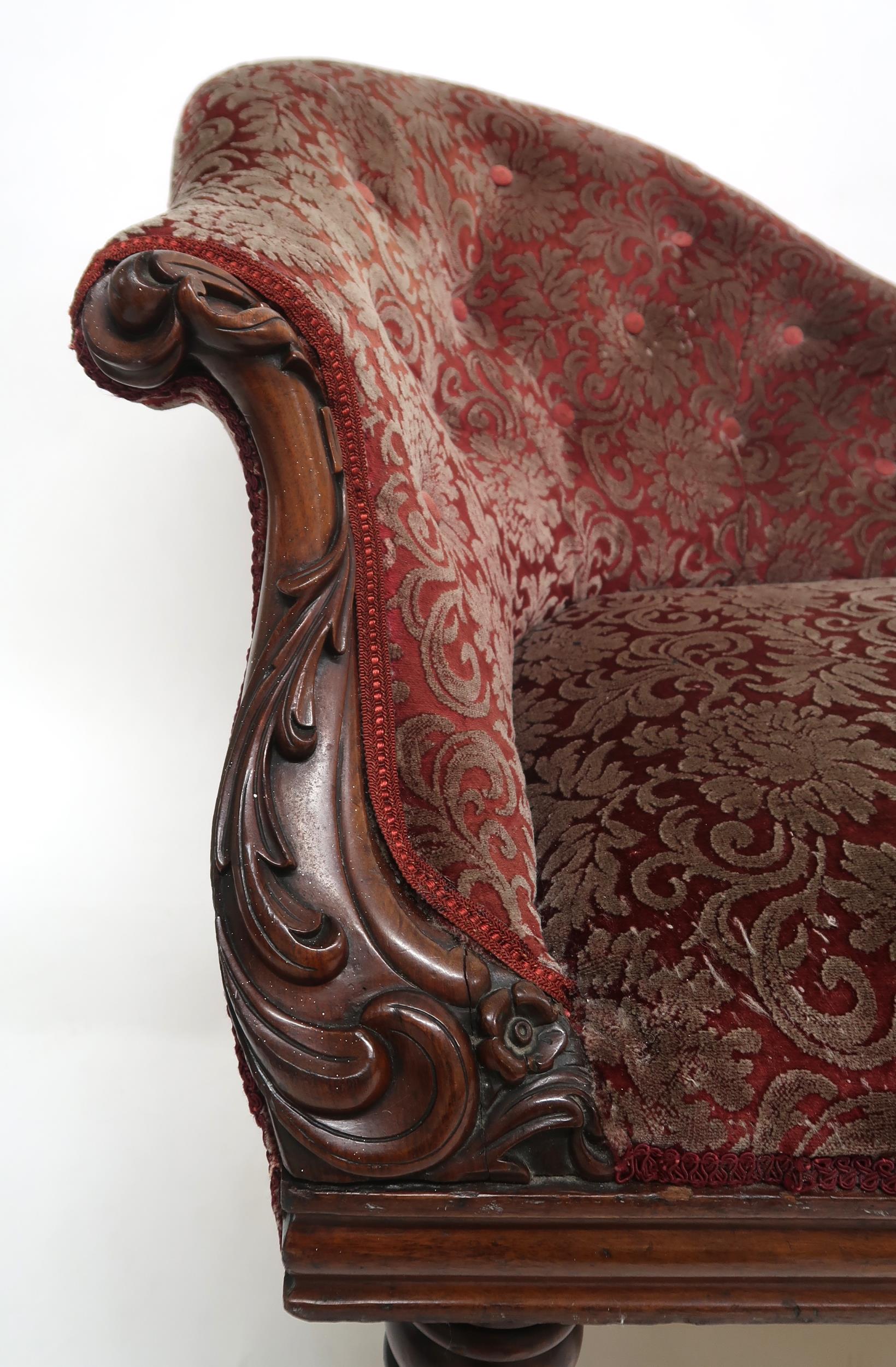 A VICTORIAN MAHOGANY FRAMED CHAISE LONGUE with foliate carvings, buttonback and seat upholstered - Image 3 of 8