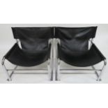 A PAIR OF MID 20TH CENTURY ROBERT KINSMAN FOR HABITAT T1 ARMCHAIRS with leather seats on chromed