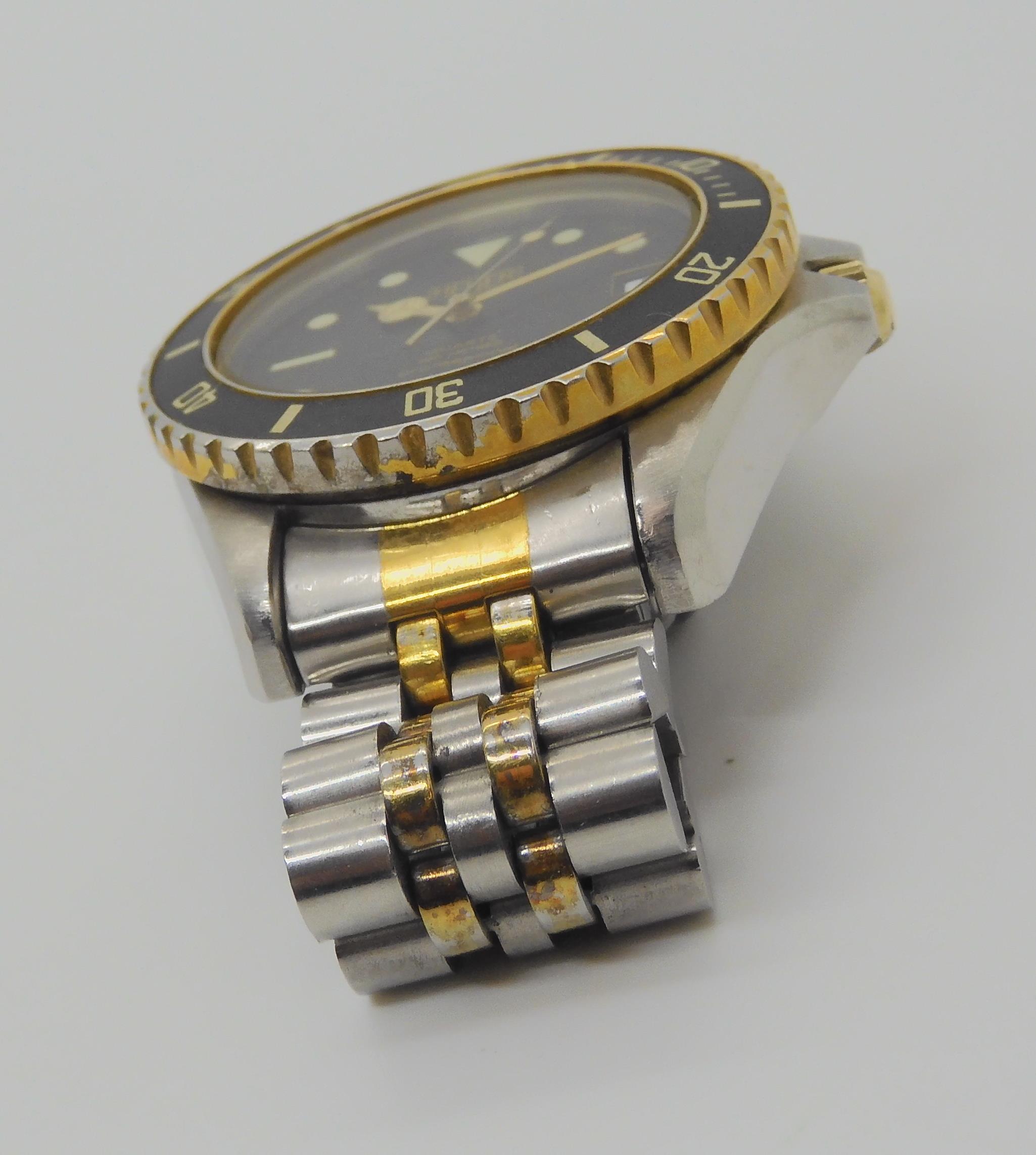 A VINTAGE HEUER WRISTWATCH circa 1983, steel and gold plate diver's watch.  The watch has a black - Image 4 of 11