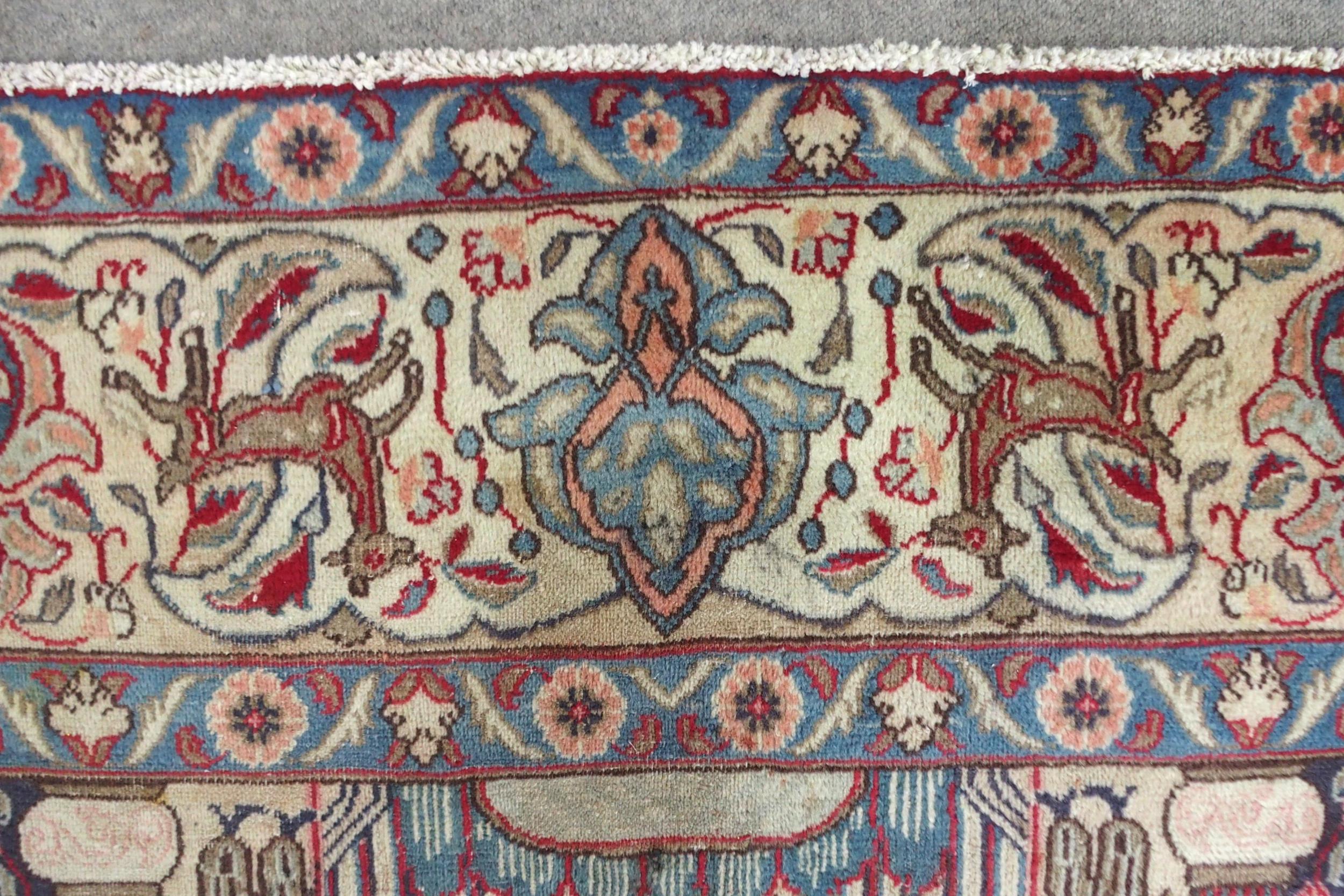 A MULTICOLOURED GROUND KASHMAR RUG with red and blue central medallion upon an extensively decorated - Image 7 of 10