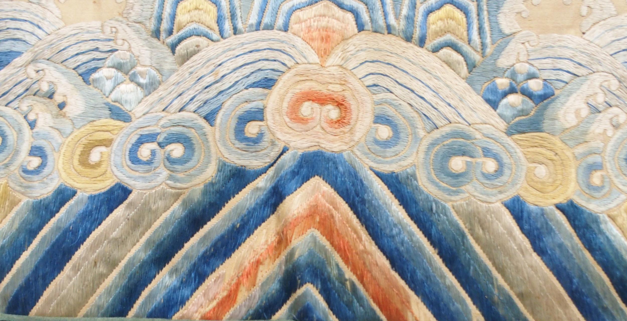 A CHINESE SILK PANEL decorated in coloured threads on a cream ground within a blue and white - Image 10 of 27