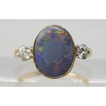 A BLACK OPAL & DIAMOND RING set with an estimated approx 12.5mm x 10mm x 3.1mm, black opal,