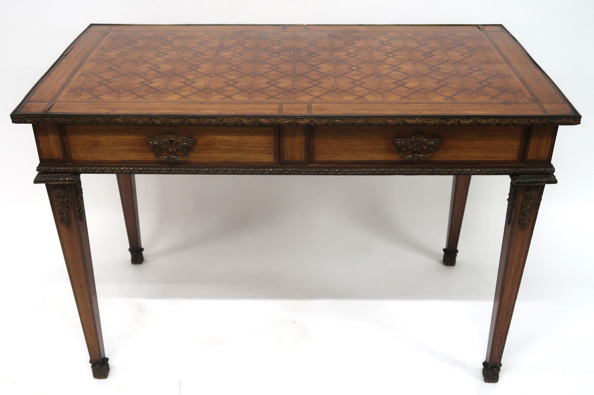 A CONTINENTAL LOUIS XVI STYLE KINGSWOOD BUREAU PLAT with parquetry inlaid top with gilt metal edge