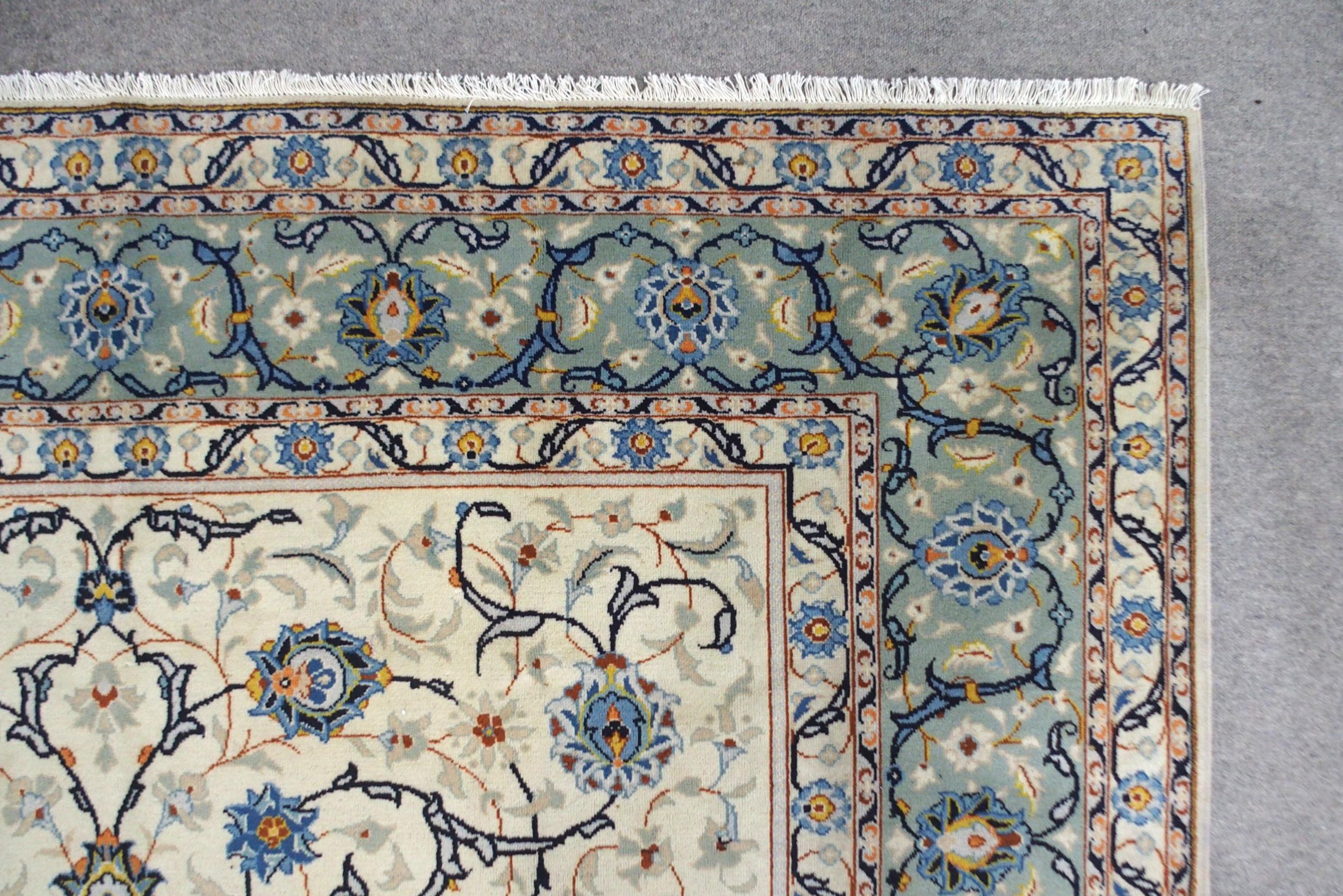 A CREAM GROUND KASHAN RUG with all-over floral design and flower head border, 361cm long x 242cm - Image 6 of 8