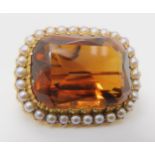 A 15CT GOLD CITRINE AND PEARL BROOCH set with a 25mm x 18mm x 12mm cognac colour citrine in cut back