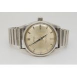 A STAINLESS STEEL ROLEX OYSTER PERPETUAL with silvered dial, silver coloured baton numerals and
