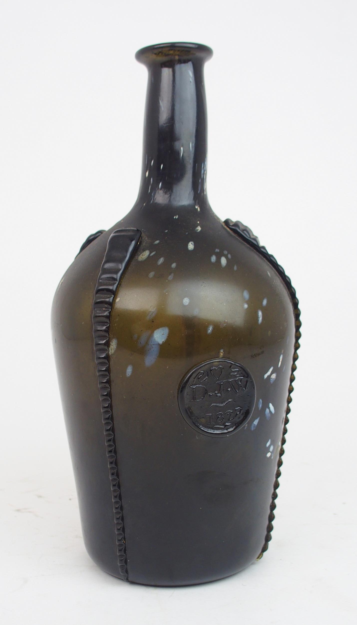 AN EARLY 19TH CENTURY ALLOA GLASS WINE BOTTLE in dark olive green mottled with white splashes, - Image 4 of 7