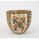 A SATSUMA LOBED CUP  painted with panels of figures and precious objects, divided by flowers, diaper