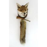 A TAXIDERMY RED FOX MASK WITH ASSOCIATED TAIL Well-modelled with partially open jaws, mounted on