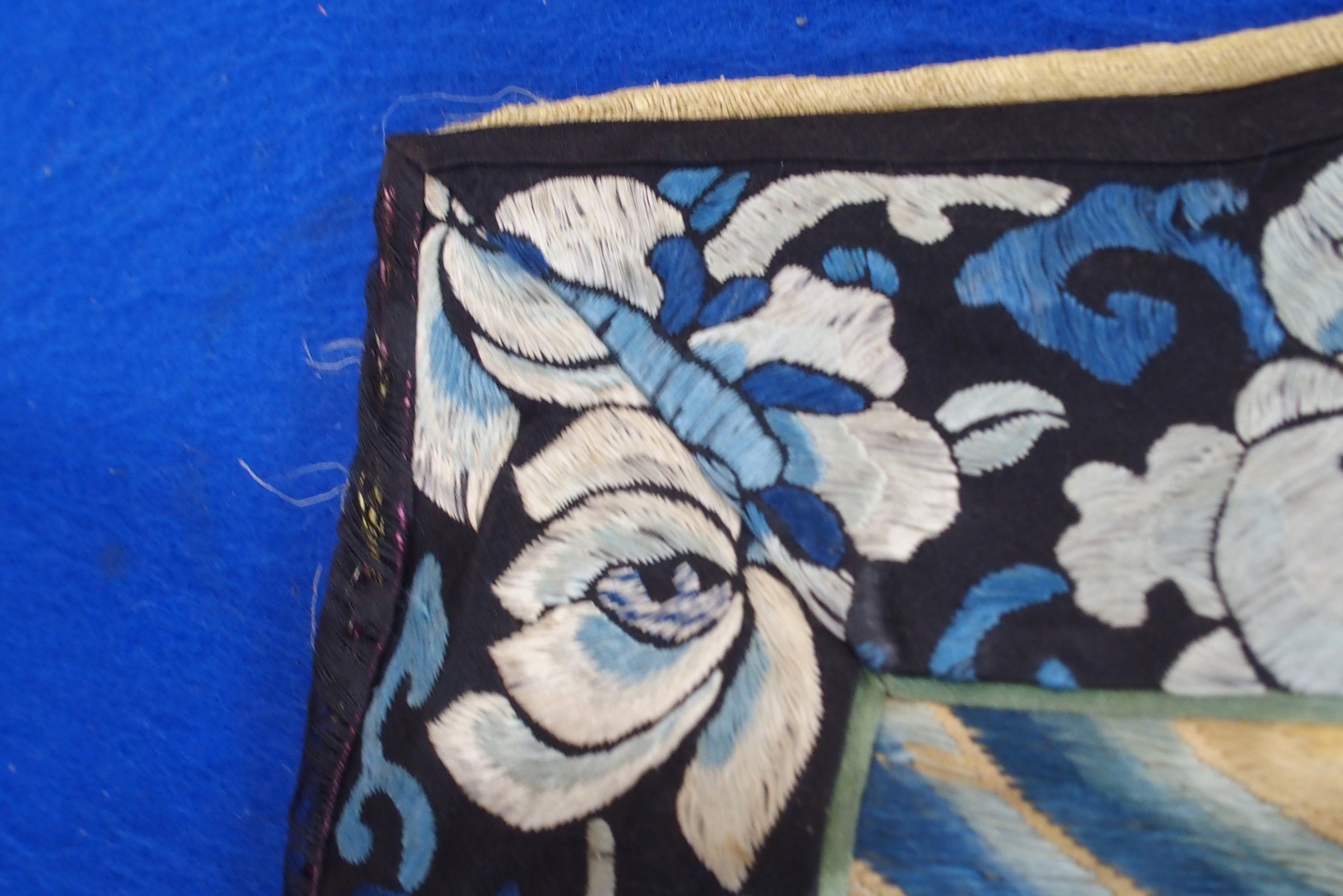 A CHINESE SILK PANEL decorated in coloured threads on a cream ground within a blue and white - Image 15 of 27