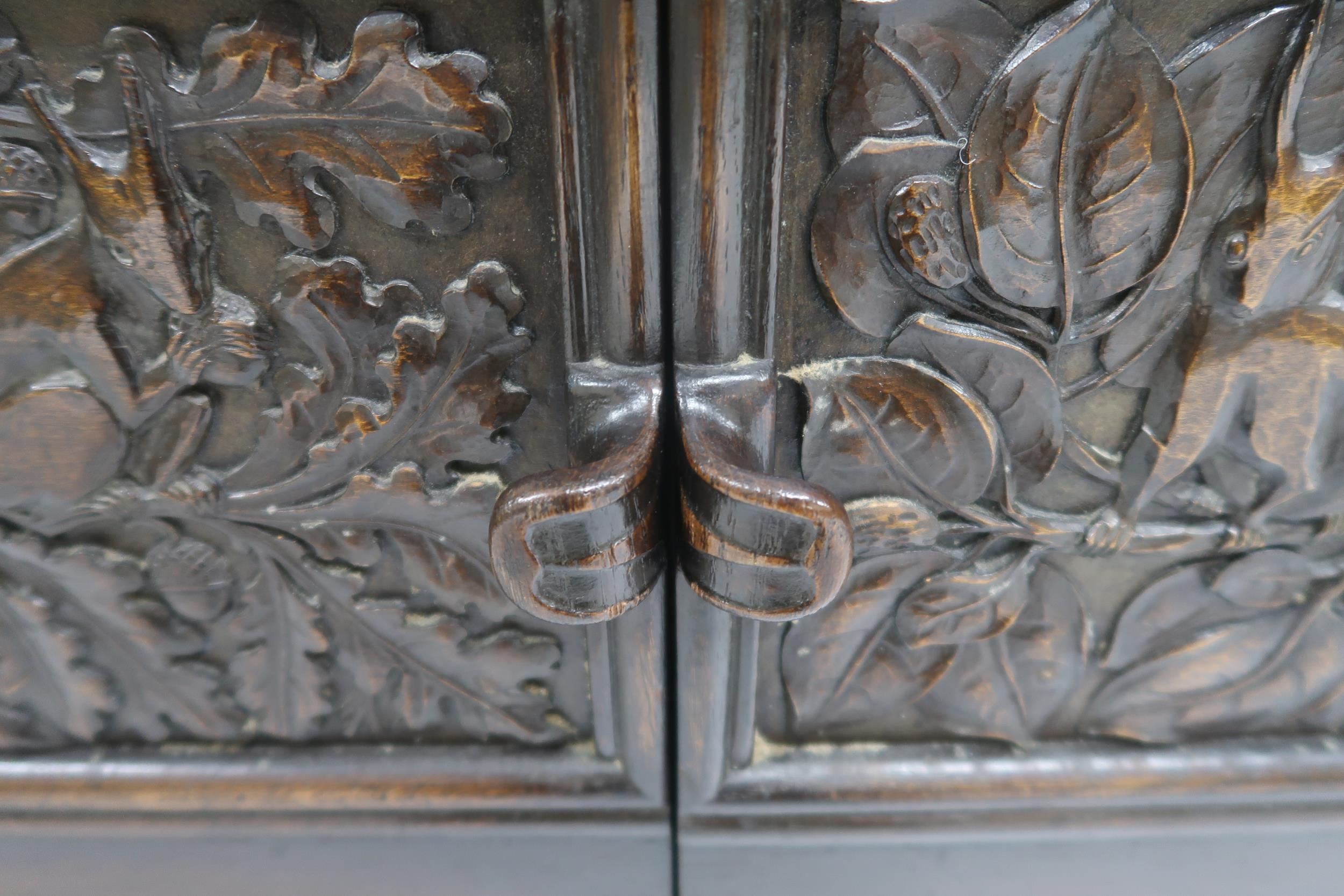 AN ARTS AND CRAFTS OAK AND BURR WALNUT COFFER the three section hinged top carved with foxes and - Image 10 of 16