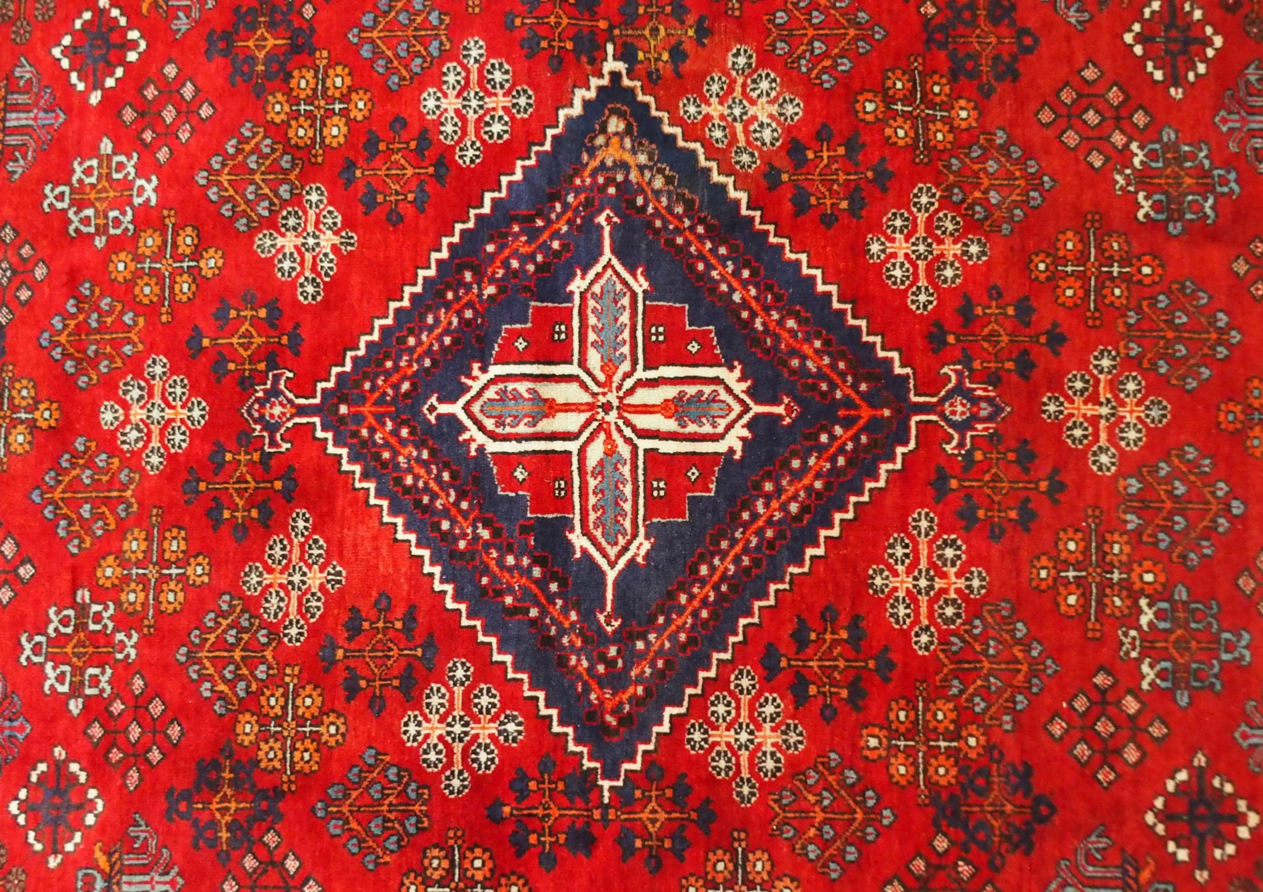 A RED GROUND MEIMEH RUG with dark blue central medallion, matching spandrels and dark blue flower - Image 2 of 10