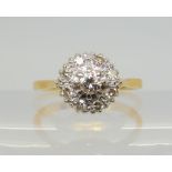AN 18CT GOLD DIAMOND CLUSTER RING set with estimated approx 0.30cts of brilliant and eight cut