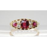 A CLASSIC RUBY & DIAMOND CLUSTER mounted throughout in bright yellow metal (partial hallmarks) the