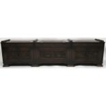AN ARTS AND CRAFTS OAK AND BURR WALNUT COFFER the three section hinged top carved with foxes and