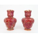 A PAIR OF LATE 19TH CENTURY CRAVEN DUNNILL JACKFIELD POTTERY VASES with red lustre glaze over relief