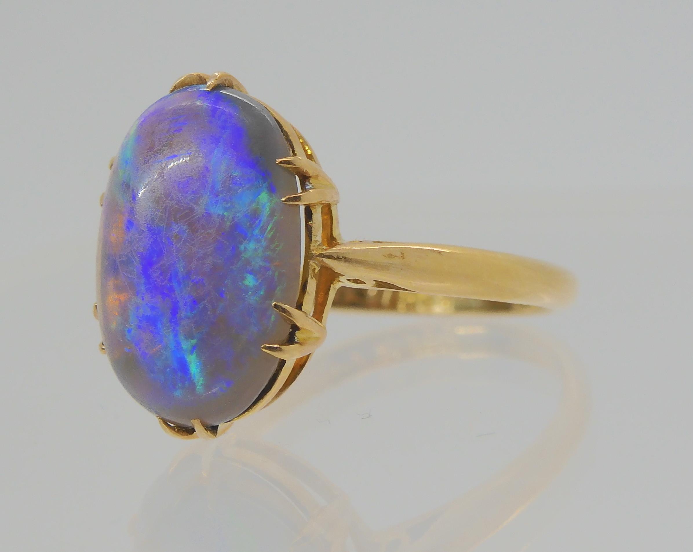 AN OPAL RING AND OTHER ITEMS The solid black opal has lively green, purple and blue colour play, and - Image 3 of 15