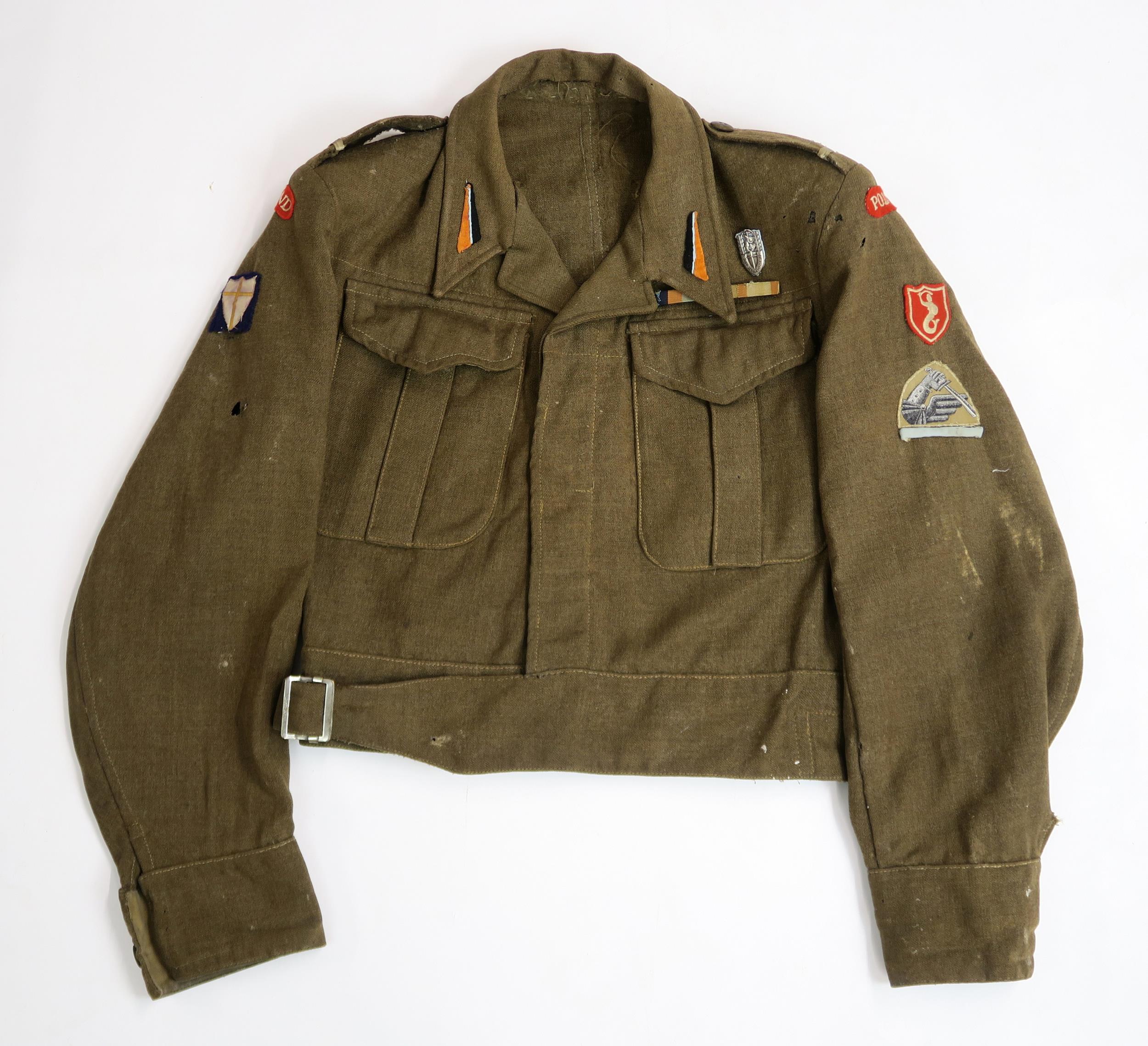 A WW2 POLISH 2ND CORPS BATTLEDRESS BLOUSE In khaki wool serge, with epaulettes bearing rank of