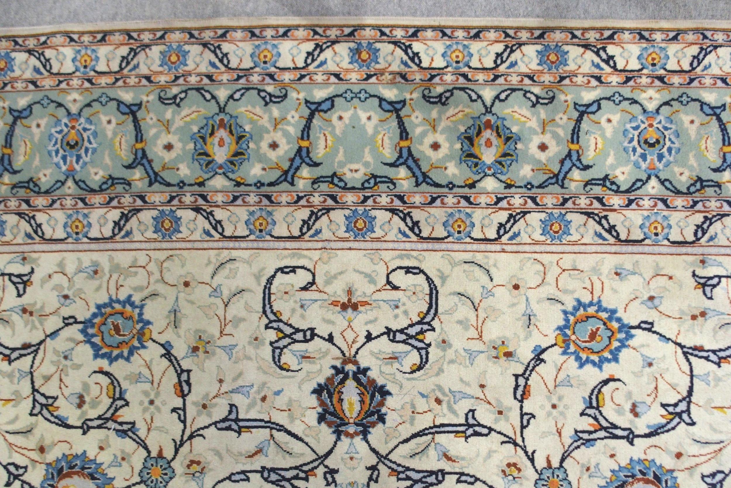 A CREAM GROUND KASHAN RUG with all-over floral design and flower head border, 361cm long x 242cm - Image 5 of 8