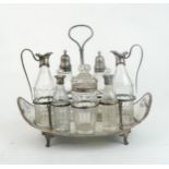 A GEORGE III SILVER CRUET STAND by Robert Hennell I, London 1792, of everted oval form, with seven