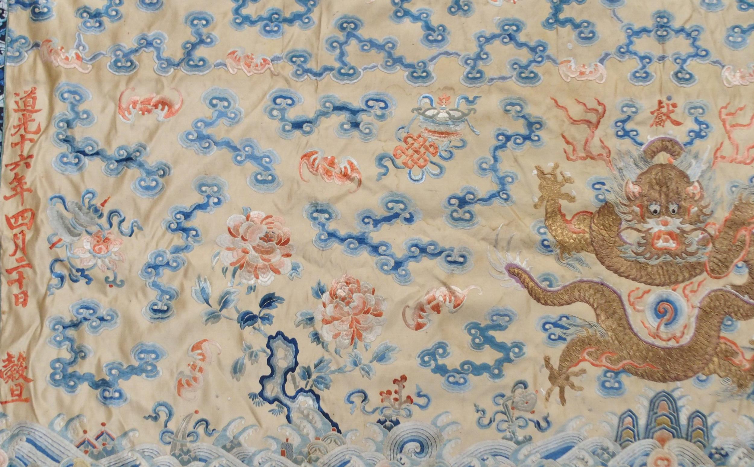 A CHINESE SILK PANEL decorated in coloured threads on a cream ground within a blue and white - Image 2 of 27
