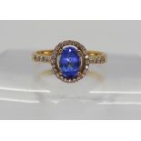 An 18ct gold tanzanite and diamond ring, finger size O1/2, weight 3.5gms Condition Report: