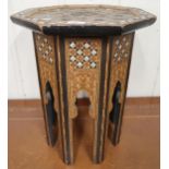 An Anglo-Moorish occasional table in the manner of Liberty & Co with mother of pearl and sample wood
