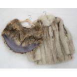 A fox fur coat and a fox fur stole, together with a reindeer hide rug Condition Report:No