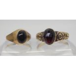 A Victorian garnet ring, inscribed from 'John Mackinlay to Agnes Mackinlay' size Q1/2, and an onyx