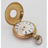 A 14k gold half hunter pocket watch, inner dust cover not gold, diameter 5cm, weight 89.5gms
