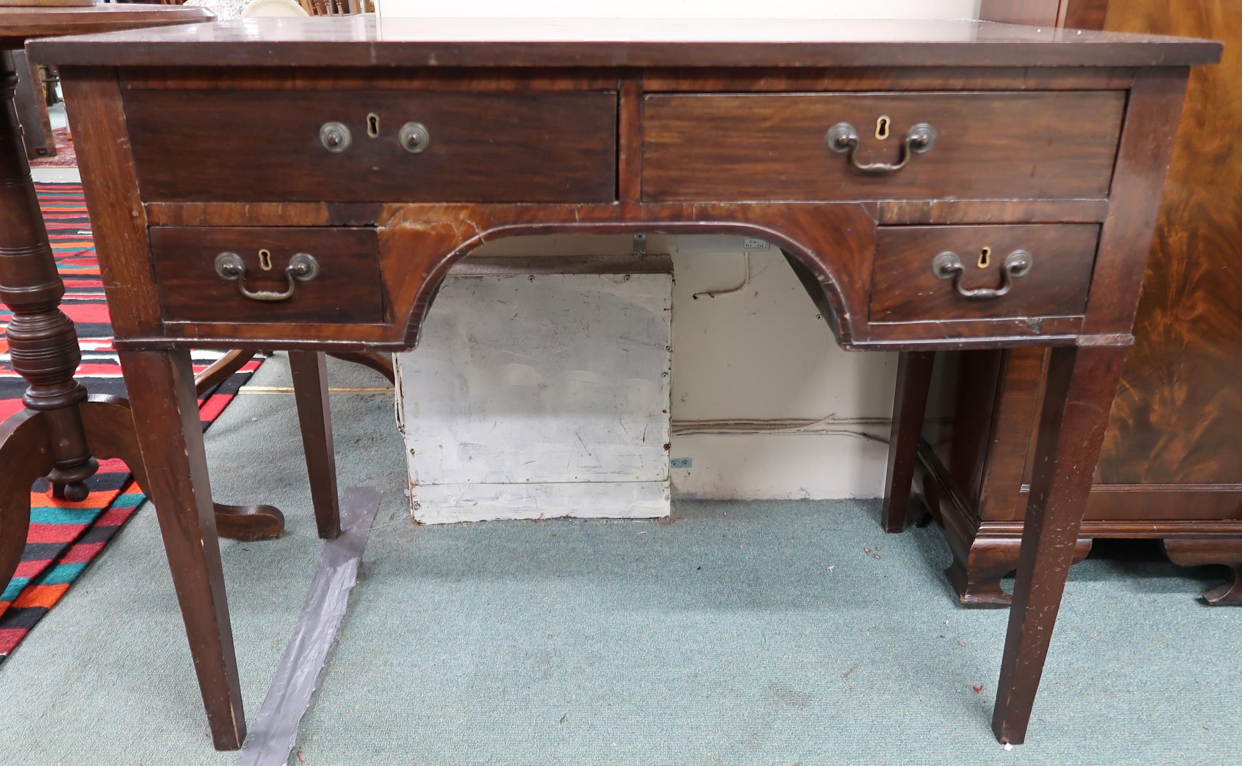 A 19th century mahogany writing desk with two long over two short drawers on square tapering