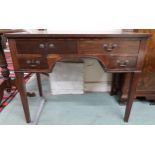 A 19th century mahogany writing desk with two long over two short drawers on square tapering