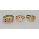 A 9ct gold RH initial ring, size W1/2, a 9ct heart shaped signet ring size R, and a signet ring S1/