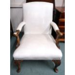 An early 20th century open armchair with white vinyl upholstery on carved cabriole supports, 93cm