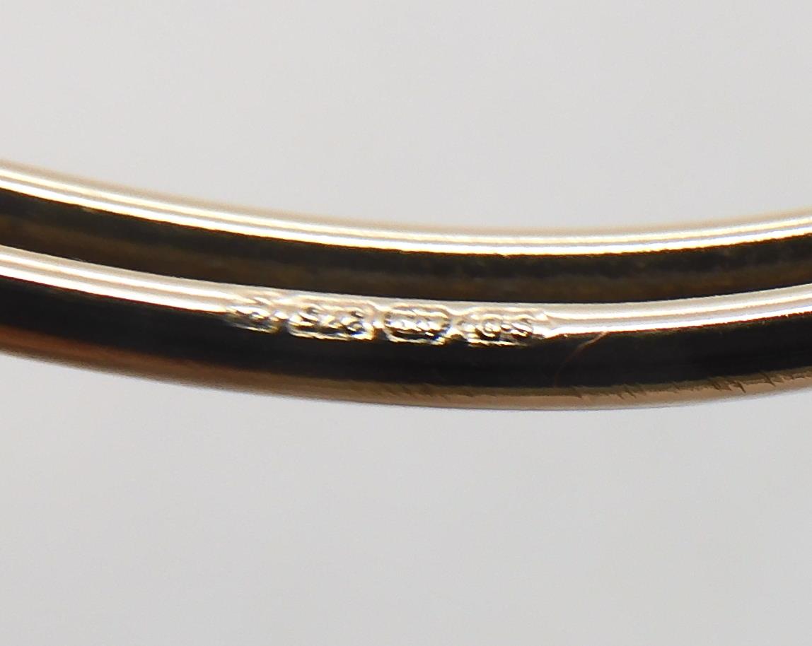 A 9ct gold knotwork bangle together with two pairs of earrings weight together 8.2gms Condition - Image 3 of 3