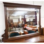 A late Victorian stained oak framed bevelled glass overmantle mirror, 117cm high x 158cm wide