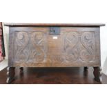 A 20th century oak kist with carved front panel, 56cm high x 91cm wide x 42cm deep Condition