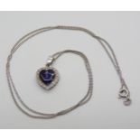 An 18ct yellow and white gold blue enamel and clear gem set heart pendant, with a 50cm 18ct white